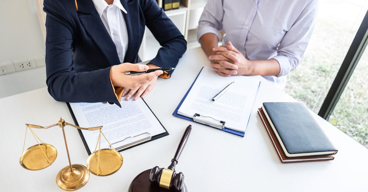 Close up of two professionals reviewing paperwork